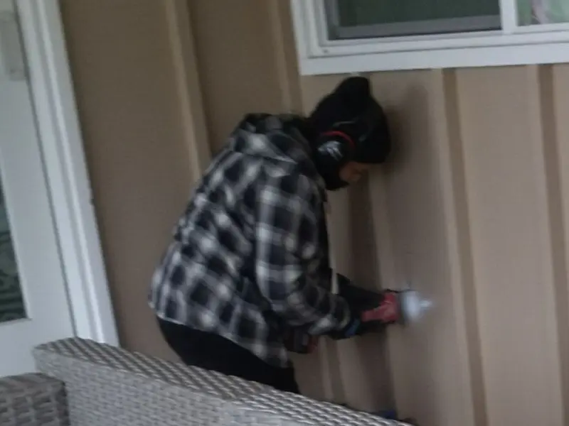 Professional electrician installing an exterior outlet in Enid