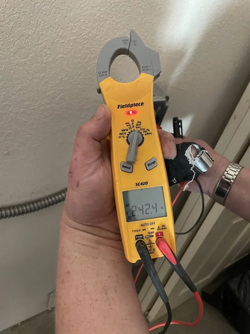 Voltage testing with clamp meter during Circuit Breaker Repair in Enid